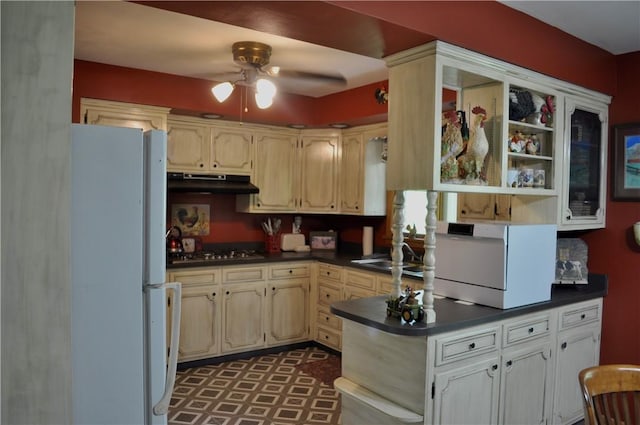 3344 Orangeville Rd, South Pymatuning Twp, PA 16150 - kitchen with freestanding refrigerator, under cabinet range hood, dark countertops, and ceiling fan