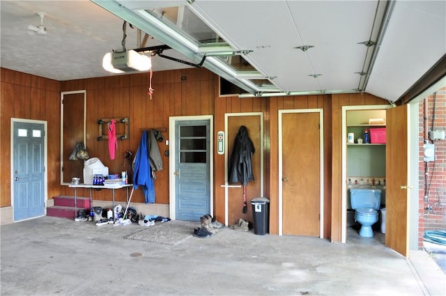 3344 Orangeville Rd, South Pymatuning Twp, PA 16150 - garage with a garage door opener and wooden walls