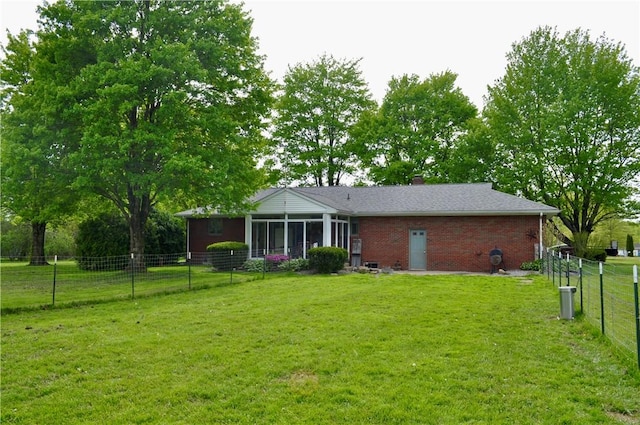 3344 Orangeville Rd, South Pymatuning Twp, PA 16150 - back of house featuring a sunroom, brick siding, and a chimney