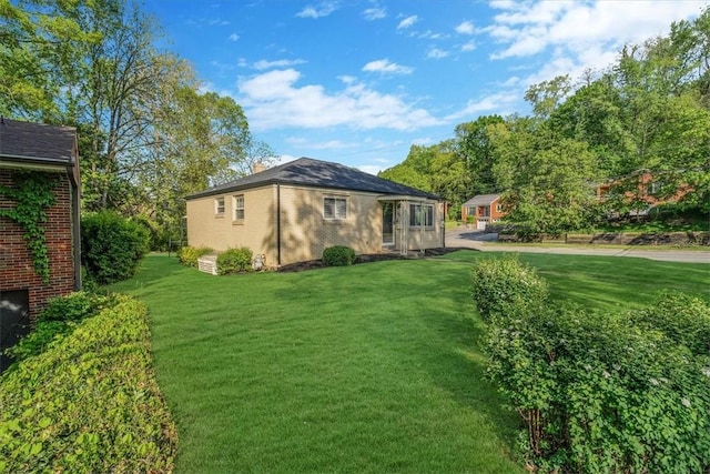 417 Orchard Dr, Mt Lebanon, PA 15228 - view of side of home featuring a lawn, brick siding, and a chimney