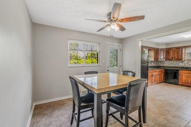 417 Orchard Dr, Mt Lebanon, PA 15228 - dining space with baseboards and a ceiling fan