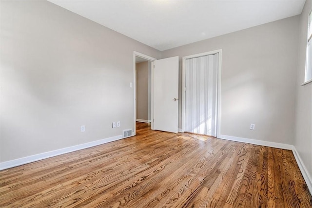417 Orchard Dr, Mt Lebanon, PA 15228 - unfurnished bedroom featuring baseboards, wood finished floors, and a closet