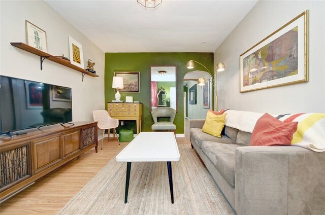 185 42nd St, Lawrenceville, PA 15201 - living area with light wood-type flooring and arched walkways