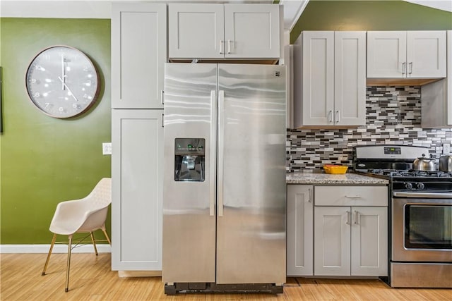 185 42nd St, Lawrenceville, PA 15201 - kitchen featuring appliances with stainless steel finishes, light wood finished floors, backsplash, gray cabinets, and light stone countertops