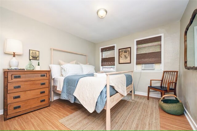 185 42nd St, Lawrenceville, PA 15201 - bedroom with light wood-style flooring, baseboards, and cooling unit