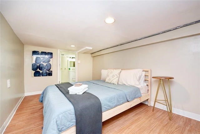 185 42nd St, Lawrenceville, PA 15201 - bedroom with wood finished floors, baseboards, recessed lighting, and connected bathroom