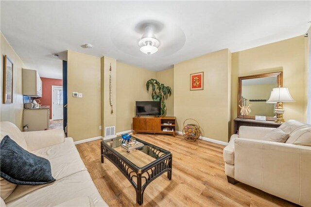 1851/2 42nd St, Lawrenceville, PA 15201 - living room featuring light wood-style floors, a ceiling fan, and baseboards