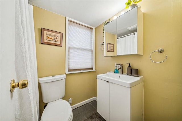 1851/2 42nd St, Lawrenceville, PA 15201 - bathroom featuring toilet, baseboards, vanity, and tile patterned floors