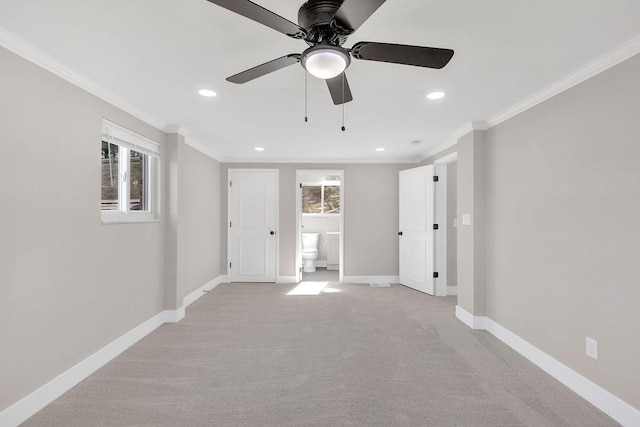 unfurnished bedroom with crown molding, baseboards, recessed lighting, light carpet, and ensuite bathroom