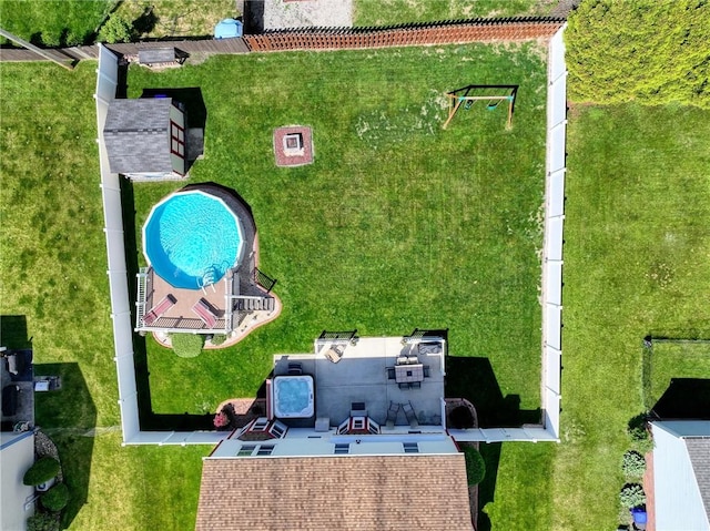 aerial view of property and surrounding area with a pool