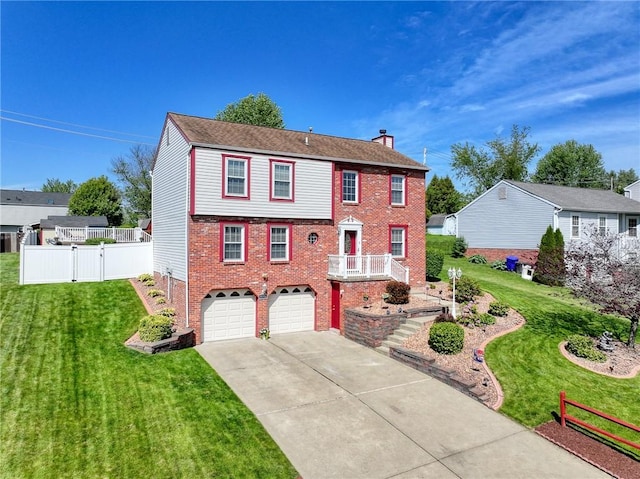 colonial home featuring brick siding, concrete driveway, a chimney, and a garage