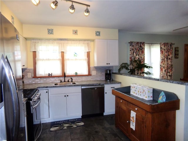 959 E Main St, Somerset Boro, PA 15501 - kitchen with stainless steel appliances, a sink, white cabinets, and tasteful backsplash