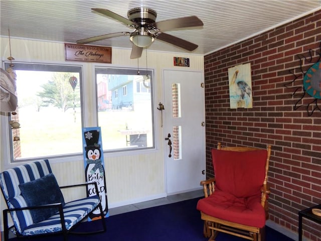959 E Main St, Somerset Boro, PA 15501 - living area with brick wall, ceiling fan, and healthy amount of natural light