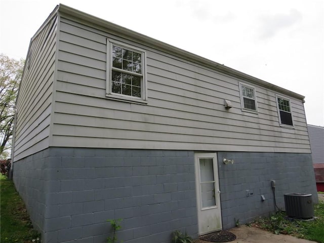 view of side of property with central AC