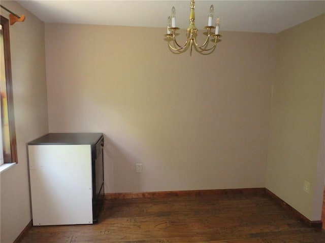 973 Glen Hayes Dr, Moon/Crescent Twp, PA 15046 - unfurnished room featuring a chandelier, wood finished floors, and baseboards