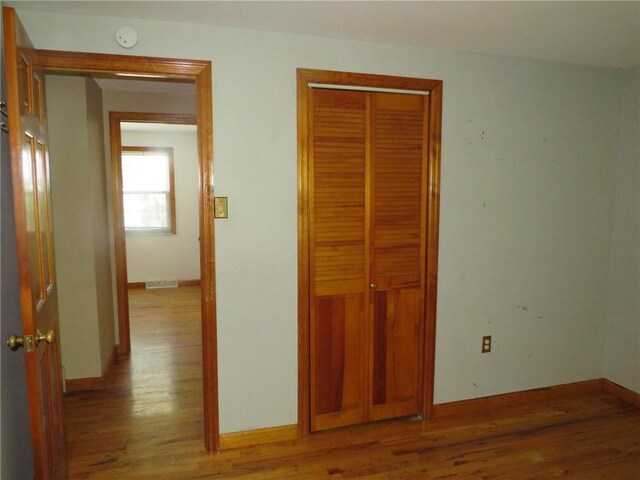973 Glen Hayes Dr, Moon/Crescent Twp, PA 15046 - unfurnished bedroom featuring wood finished floors, a closet, and baseboards