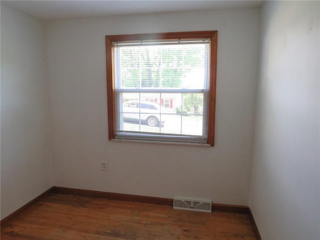 973 Glen Hayes Dr, Moon/Crescent Twp, PA 15046 - unfurnished room featuring plenty of natural light, wood finished floors, and baseboards