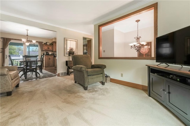 living room with a chandelier, light carpet, ornamental molding, and baseboards