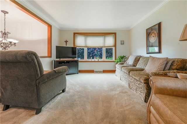 living room featuring carpet, ornamental molding, a chandelier, and baseboards
