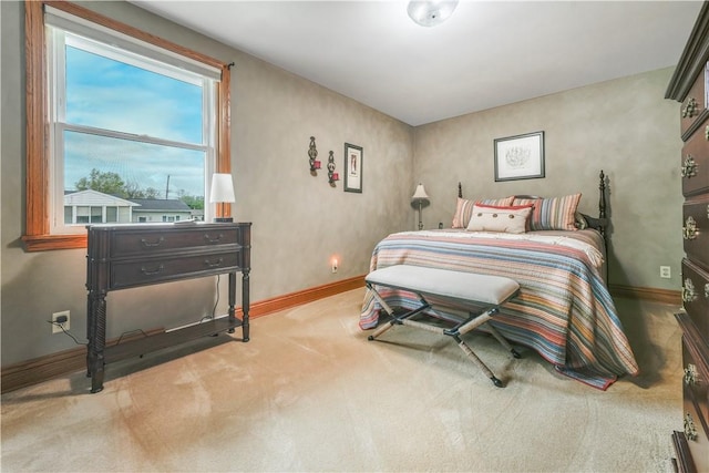 carpeted bedroom with baseboards
