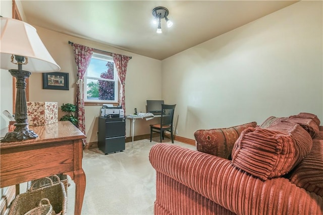 office space with light carpet and baseboards