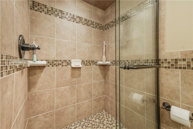 bathroom featuring a shower stall