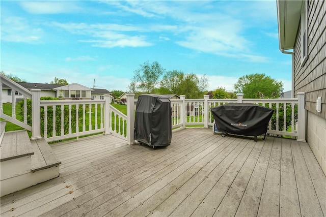 wooden deck featuring area for grilling