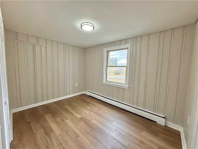 701 Mercer Rd, Twp Of But Nw, PA 16001 - unfurnished room with a baseboard heating unit and wood finished floors