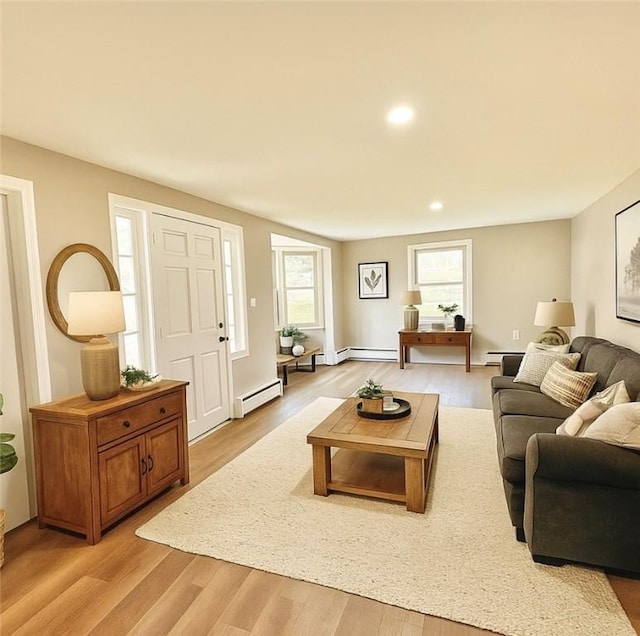 701 Mercer Rd, Twp Of But Nw, PA 16001 - living room featuring a baseboard heating unit, plenty of natural light, light wood-style floors, recessed lighting, and a baseboard radiator