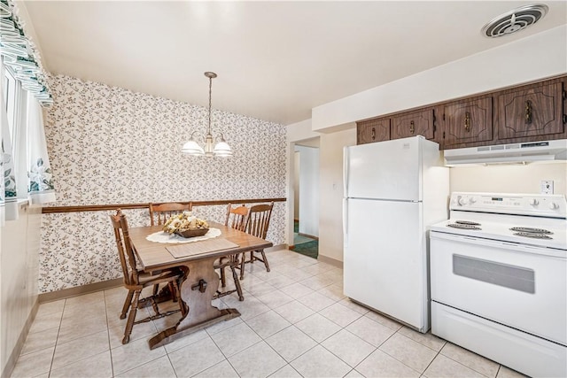 741 Whitehead Ln, North Huntingdon, PA 15642 - kitchen with wallpapered walls, white appliances, under cabinet range hood, a chandelier, and dark brown cabinets