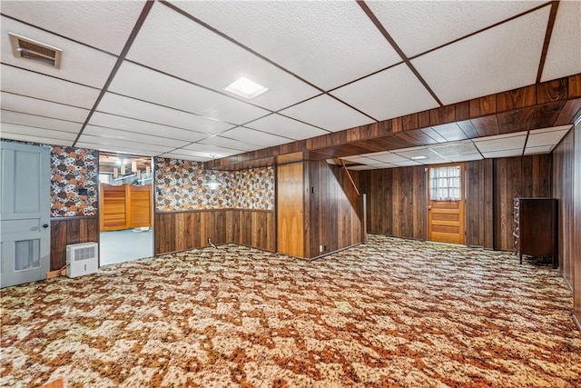 741 Whitehead Ln, North Huntingdon, PA 15642 - below grade area with carpet floors, wood walls, and a drop ceiling