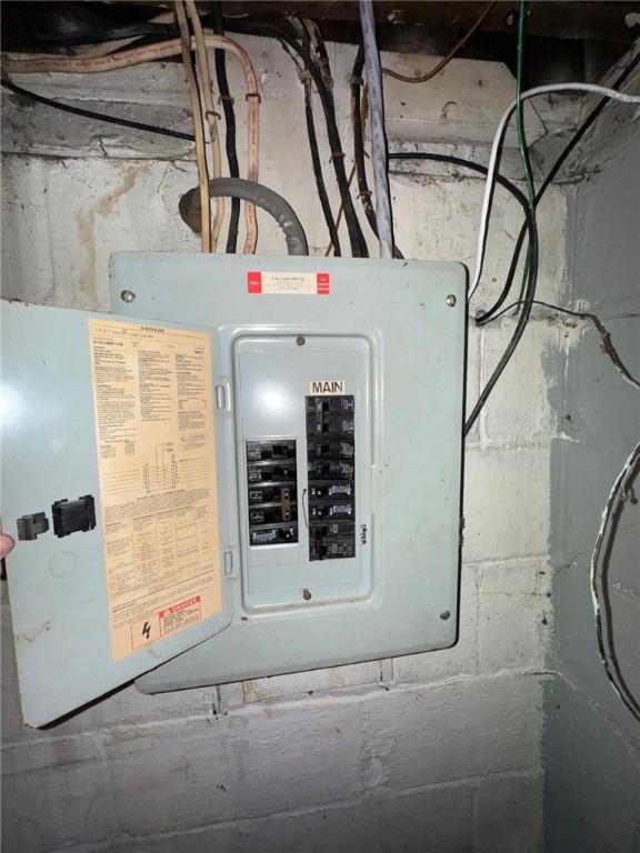 utility room featuring electric panel