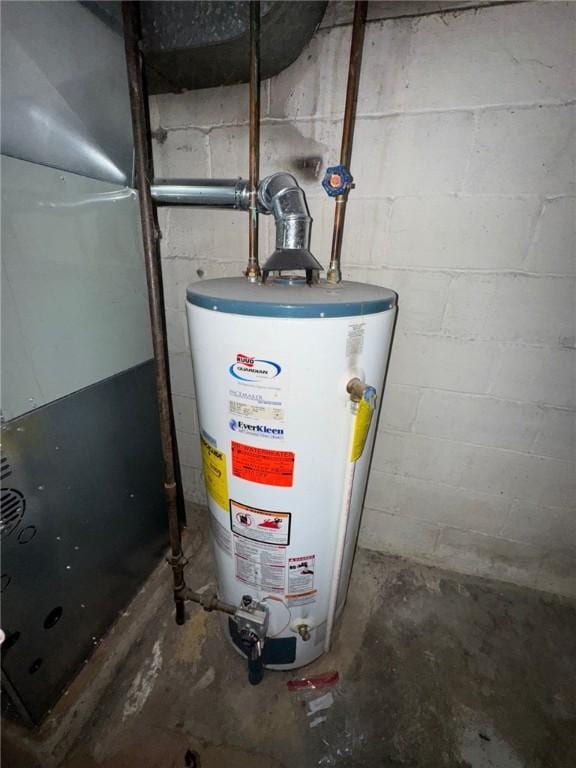 utility room with water heater