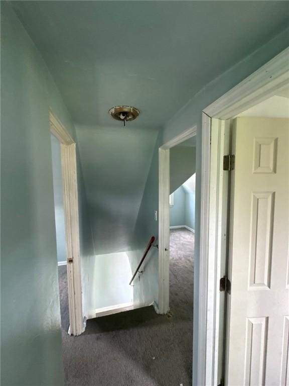 hall with carpet and an upstairs landing