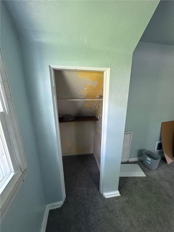 unfurnished bedroom with carpet floors and baseboards
