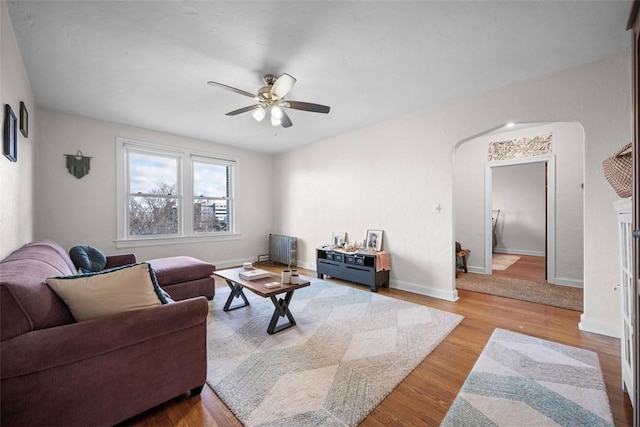 372 S Highland Ave Unit 606, Shadyside, PA 15206 - living room featuring ceiling fan, wood finished floors, baseboards, and arched walkways