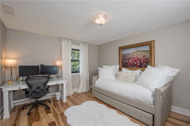 office area with wood finished floors and baseboards