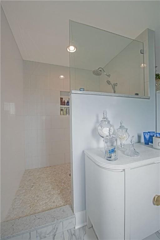 full bathroom with a walk in shower and marble look tile flooring
