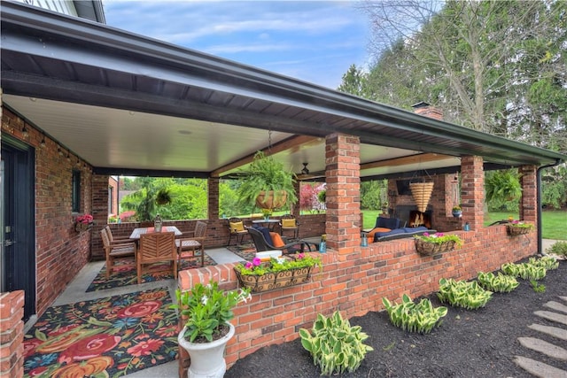 view of patio / terrace featuring an outdoor living space with a fireplace