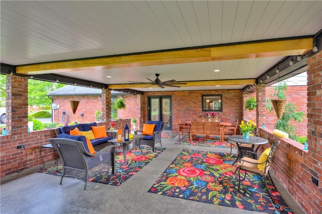 view of patio / terrace with an outdoor living space and a ceiling fan