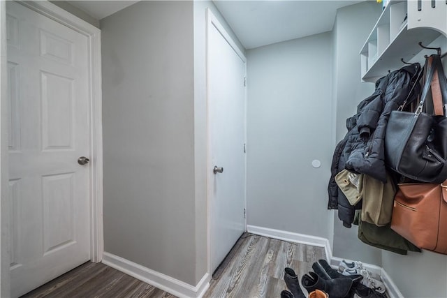 mudroom featuring wood finished floors and baseboards