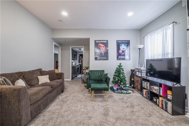 living room with carpet flooring, recessed lighting, and baseboards