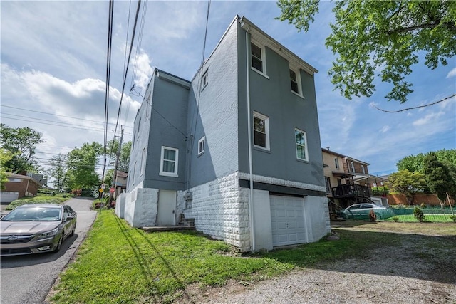 1720 Stratmore St, Crafton Heights, PA 15205 - view of property exterior with a garage, driveway, and stucco siding