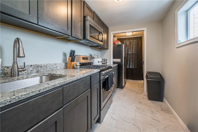 1720 Stratmore St, Crafton Heights, PA 15205 - kitchen with stainless steel appliances, light marble finish flooring, light stone counters, and dark brown cabinetry