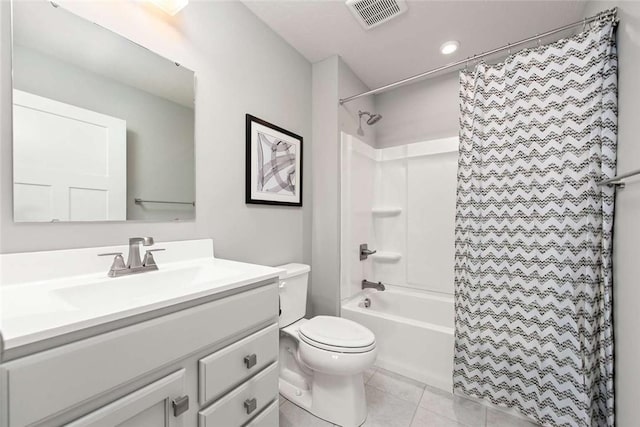 bathroom featuring tile patterned flooring, vanity, toilet, and shower / tub combo