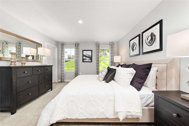 bedroom with light colored carpet