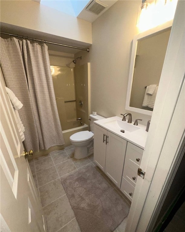 full bath featuring tile patterned floors, shower / tub combo, toilet, and vanity