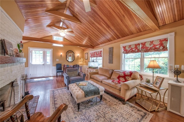 1010 Glenshaw Ave, Shaler, PA 15116 - living room with a ceiling fan, wood ceiling, a wainscoted wall, a fireplace, and wood finished floors