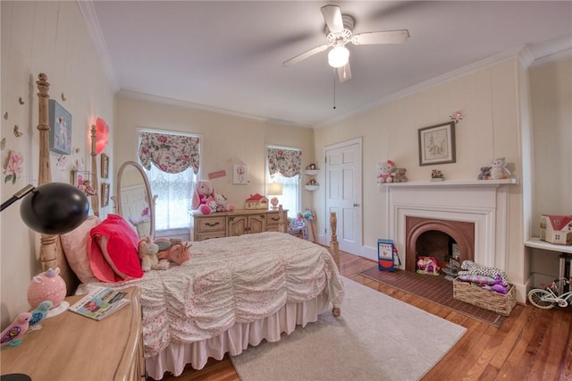 1010 Glenshaw Ave, Shaler, PA 15116 - bedroom featuring crown molding, hardwood / wood-style floors, a fireplace, and a ceiling fan