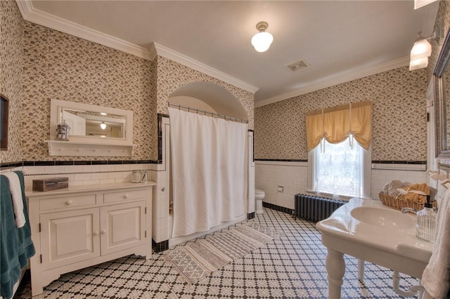 1010 Glenshaw Ave, Shaler, PA 15116 - bathroom with radiator heating unit, crown molding, a wainscoted wall, wallpapered walls, and tile walls